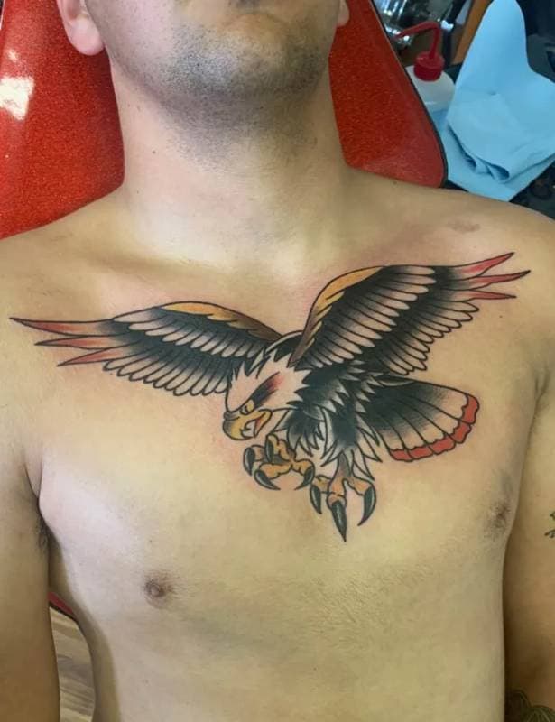Colorful eagle tattoo on the chest.